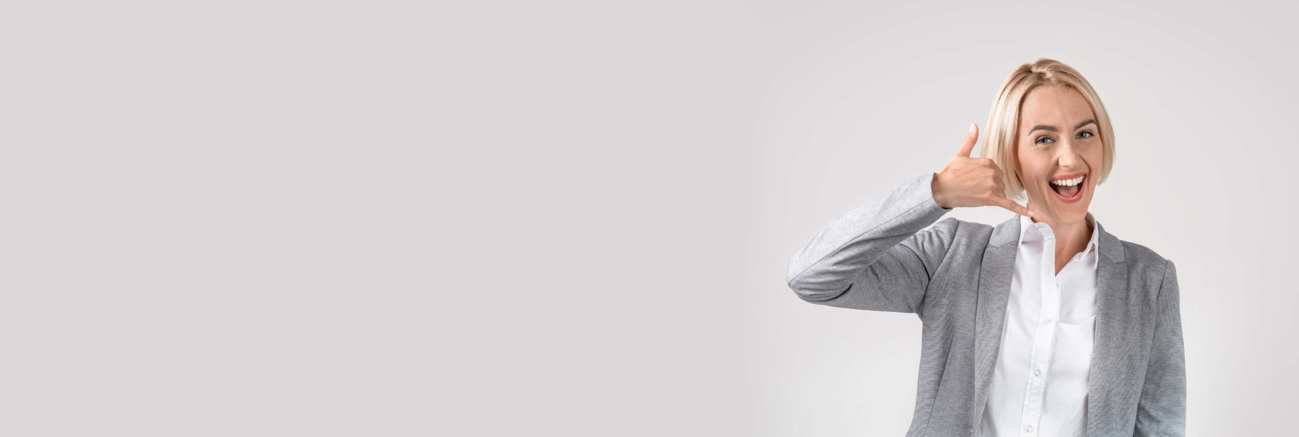 Contact Us. Wide Horizontal Banner With Smiling Businesswoman Showing Phone Call Gesture